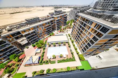an aerial view of a city with tall buildings at Studio in Dubai Production City in Dubai