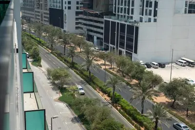 an aerial view of a city street with palm trees at Ahlan HH - Brand New Summer Suite, Near Circle Mall in Dubai