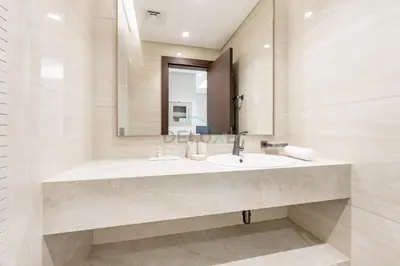 a bathroom with a sink and a mirror at Skyline View 1BR, Minutes Away from Downtown and Dubai Mall, Nobles Tower, Business Bay by Deluxe Holiday Homes in Dubai