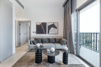 a living room with a couch and a table at ALiving Modern & Chic 1BR I MAG960 in Dubai