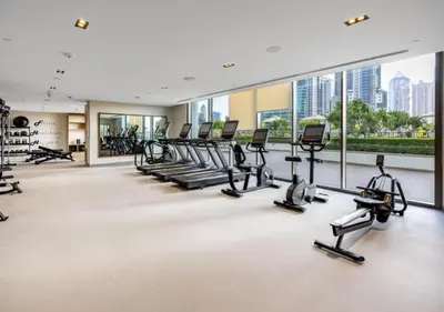a gym with treadmills and ellipticals in a building at Luxurious and Spacious 2BR Burj Crown Downtown in Dubai