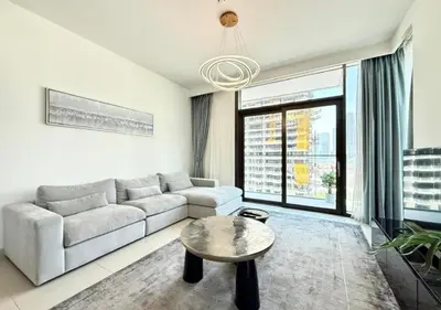 a living room with a couch and a table at Luxurious and Spacious 2BR Burj Crown Downtown in Dubai