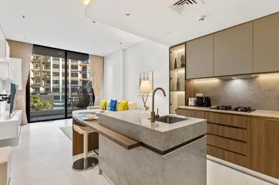 a kitchen with a sink and a counter top at Chic Retreat 1Bedroom with Pool view in Dubai