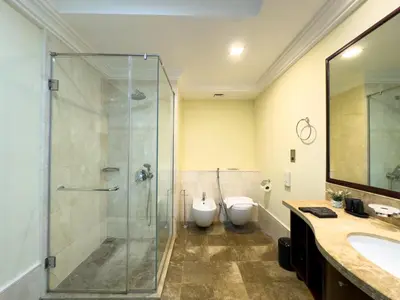 a bathroom with a shower and a toilet and a sink at Luxury 2BR plus Maidrm at Grandeur Res Palm Jumeir in Dubai