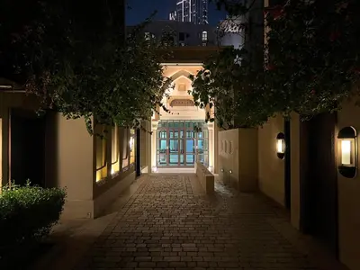 an alleyway with a door in a building at night at Front Burj Khalifa 2BR in Old town community in Dubai