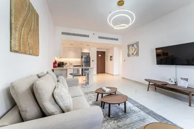 a living room with a couch and a table at HAVN - 1 Bedroom in Madinat Jumeirah Living in Dubai