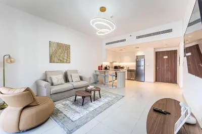 a living room with a couch and a table at HAVN - 1 Bedroom in Madinat Jumeirah Living in Dubai