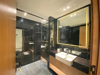 a bathroom with a sink and a mirror at Modern & Cozy 1 Bedroom Apartment in JVC 215-GLX-1 in Dubai