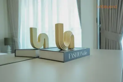 two trophies sitting on top of a table at Bnbeyond's Chic Urban Retreat with Upscale 1BR in Dubai