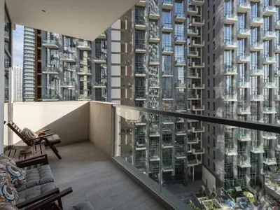a balcony with a view of tall buildings at Chic City Escape - 2BR Plus Guest Room at Atria, Business Bay in Dubai