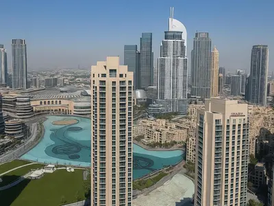 an aerial view of a city with tall buildings at Dream Shoma Upscale 3BR in Downtown Dubai in Dubai