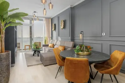 a living room with a table and a couch at BLVD - Upgraded Highrise Suites in Dubai