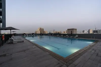 a large swimming pool on the roof of a building at BLVD - Upgraded Highrise Suites in Dubai