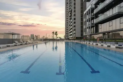 a large swimming pool on top of a building at BLVD - Upgraded Highrise Suites in Dubai