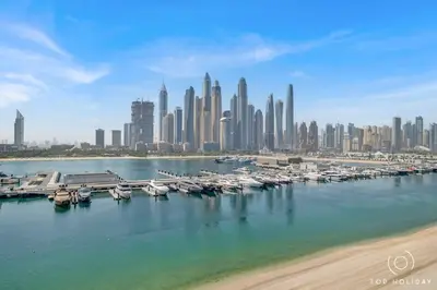a group of boats docked at a marina in a city at Romantic basic apertmen in Dubai