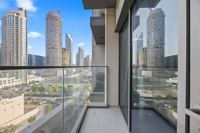 an apartment balcony with a view of the city at Dreamy Apartment,Pool with Burj khalifa View ,5Min Walk to Dubai Mall in Dubai