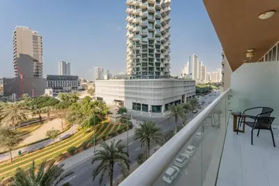 a balcony with a view of a city at Vacationer I JVC Gem 1 Bedroom I Free Pool, Gym, Parking & Wi-Fi in Dubai