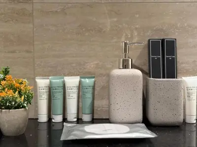 a group of products sitting on a table at Cozy Studio with Balcony Pool View - Business Bay in Dubai