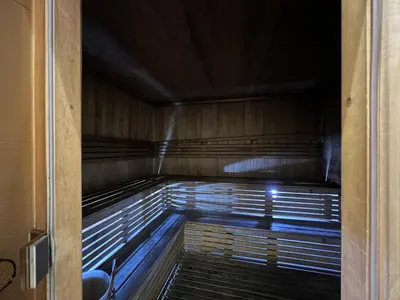 an empty sauna with the lights on at Luxury Apartment 2BR with Sea & Palm View - DAMAC Heights in Dubai