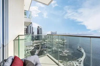 an apartment balcony with a view of the harbor at Stunning Home with Creek and Downtown Views in Dubai