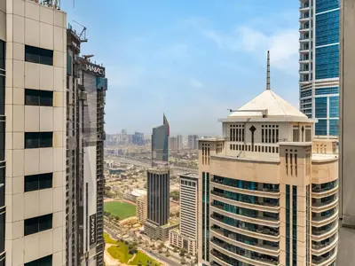 an aerial view of a city with tall buildings at Amazing Design Colorfull Flat Palm Jumeirah View in Heart of Marina in Dubai