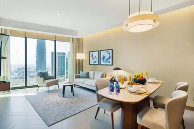 a living room with a table and a couch at Address Opera - Ultra luxurious 2BDR in Downtown in Dubai