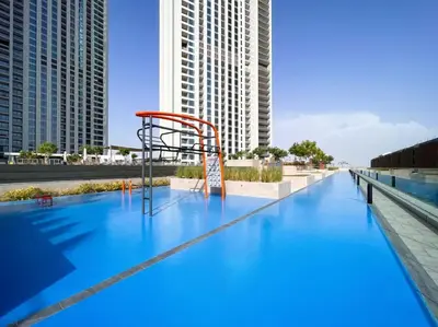 a pool with a basketball hoop on top of a building at Ultimate Luxury 3BDR With Burj Khalifa view in Dubai