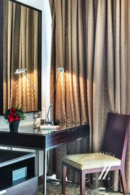 a desk with a mirror and a desk with a chair at Luxurious Studio Flat with Burj Khalifa Views in Dubai
