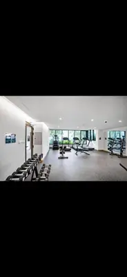 a large room with chairs and tables in a building at Studio Apartment Near downtown Dubai in Dubai