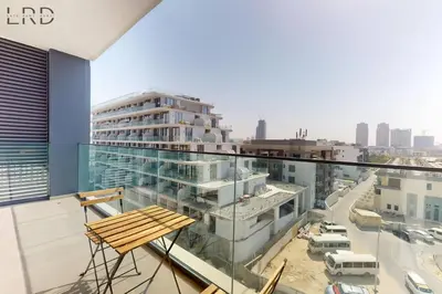 a balcony with a view of a city at Brand New and Modern 1BR in Dubai