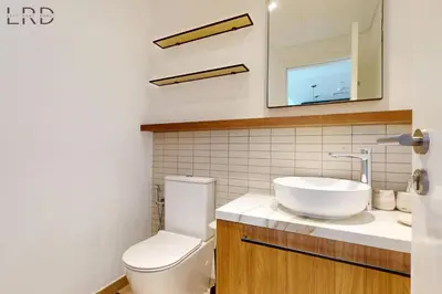 a bathroom with a white toilet and a sink at Brand New and Modern 1BR in Dubai