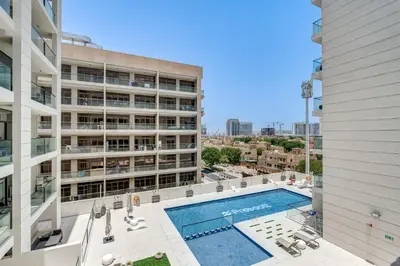an overhead view of a swimming pool in a building at PVH - Contemporary Studio - Prime Residency 3 in Dubai