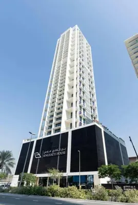 a tall building with a sign on the side of it at Aesthetic 1br In Binghatti House Free Pool Gym in Dubai