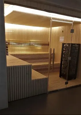 a row of empty benches in a room at Luxury Studio Pool & Gym Access in Dubai Sports City in Dubai