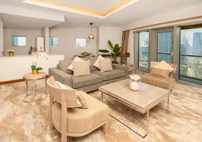 a living room with a couch and a table at Fashion Avenue Dubai Mall in Dubai