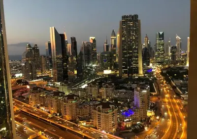 a view of a city at night with traffic at Fashion Avenue Dubai Mall in Dubai