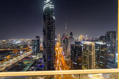 a city skyline at night with a tall building at Luxury 4BHK in Business Bay w Burj Khalifa View Noora 4203 in Dubai