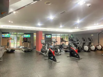 a gym with a bunch of exercise bikes in it at Silkhaus Luxurious 1BDR in Downtown in Dubai