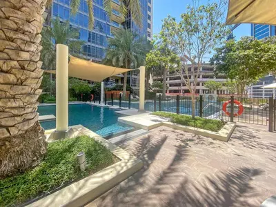 a swimming pool in the middle of a city at Silkhaus Luxurious 1BDR in Downtown in Dubai