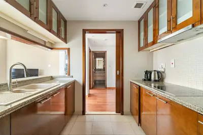 a kitchen with a sink and a counter top at Silkhaus Luxurious 1BDR in Downtown in Dubai