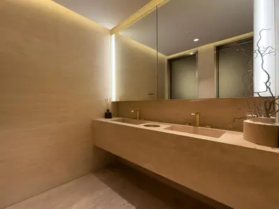 a bathroom with two sinks and a large mirror at Luxury Studio in Urban Oasis, Business Bay in Dubai