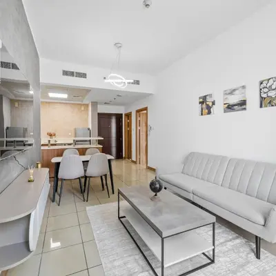 a living room with a couch and a table at 1BR in Sulafa Tower- Ideal for Short-Term Stay in Dubai