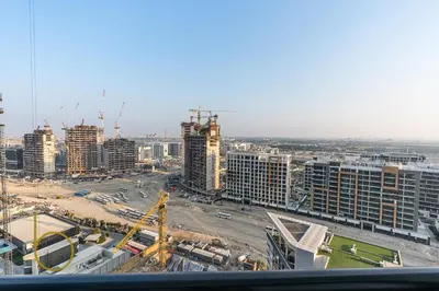a view of a large city with tall buildings at Bookable - 2 Bedroom Sobha Waves, Sobha Hartland in Dubai