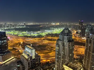 a view of a city at night with traffic at DAYF-MGA Spacious 3Bed with Full Marina View in Dubai