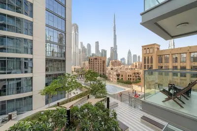 an apartment balcony with a view of the city at FIRST CLASS 1BR Burj Views & Classy Comfort in Dubai