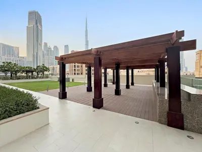 a wooden pavilion with a view of a city at FIRST CLASS 1BR Burj Views & Classy Comfort in Dubai
