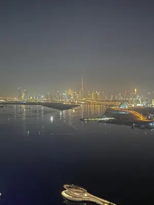 a large body of water with a city in the background at 3403!Dubai SkyLine View! Royal Montania Homes in Dubai