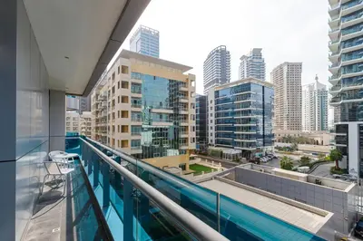 a view of a city from the balcony of a building at Bright 1BR with Marina Views - Orra Marina - Allsopp & Allsopp in Dubai