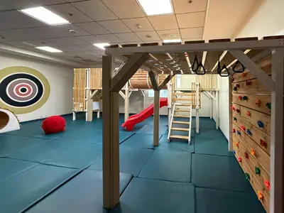 a kids room with a climbing wall and a ladder at Frank Porter - B324 - 5112 Elite Residence in Dubai