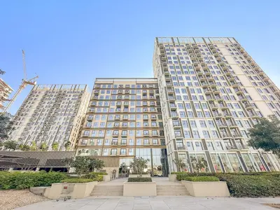 a large apartment building with stairs in front of it at FIRST CLASS 1BR Modern Majesty in Dubai Hills in Dubai